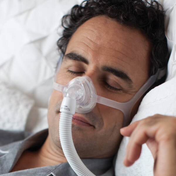 Man Using Philips Respironics Mask